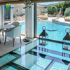 Walkable Clear Laminated Glass Floor installed over indoor water feature